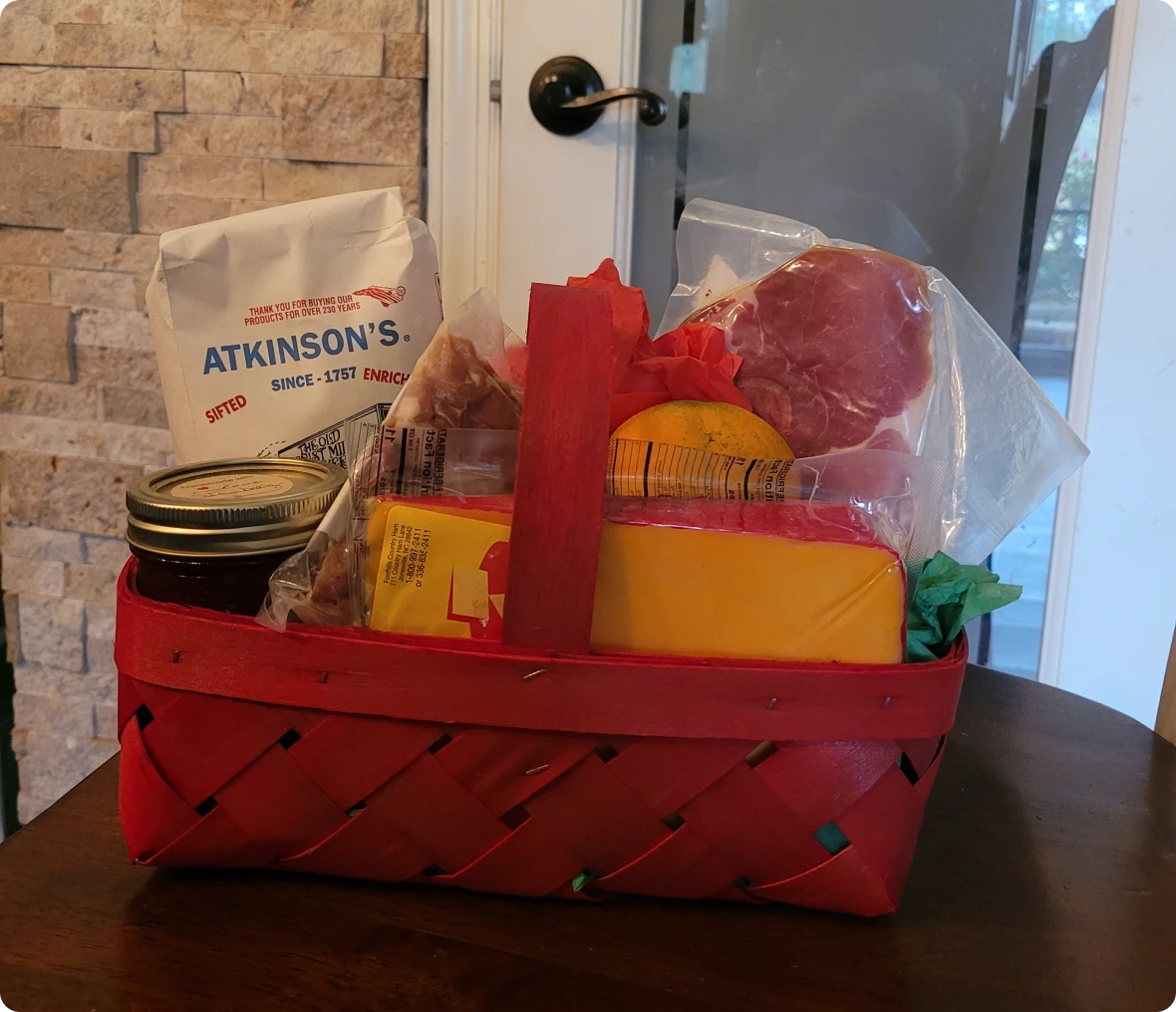 Red basket with assorted food items.
